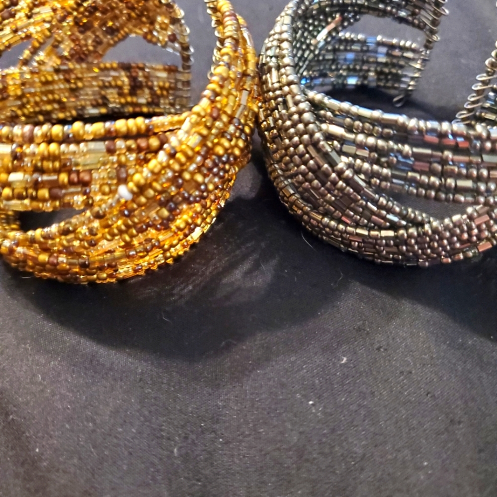 2 beaded bracelets one size. They expand for large wrists.